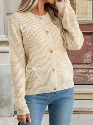 Khaki ribbed knit cardigan with bow accents and gold buttons.