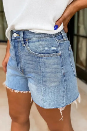 Light wash denim shorts with frayed hem and distressed details