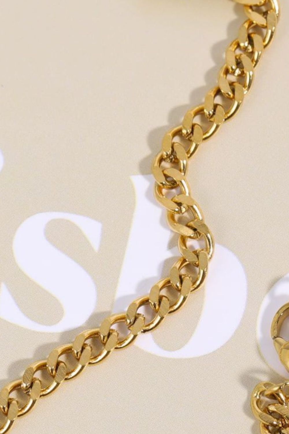 Gold curb chain necklace with cubic zirconia detail