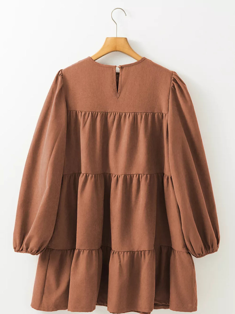 90% polyester, 10% elastane Care instructions: Machine wash cold mini dress in rust brown with relaxed silhouette