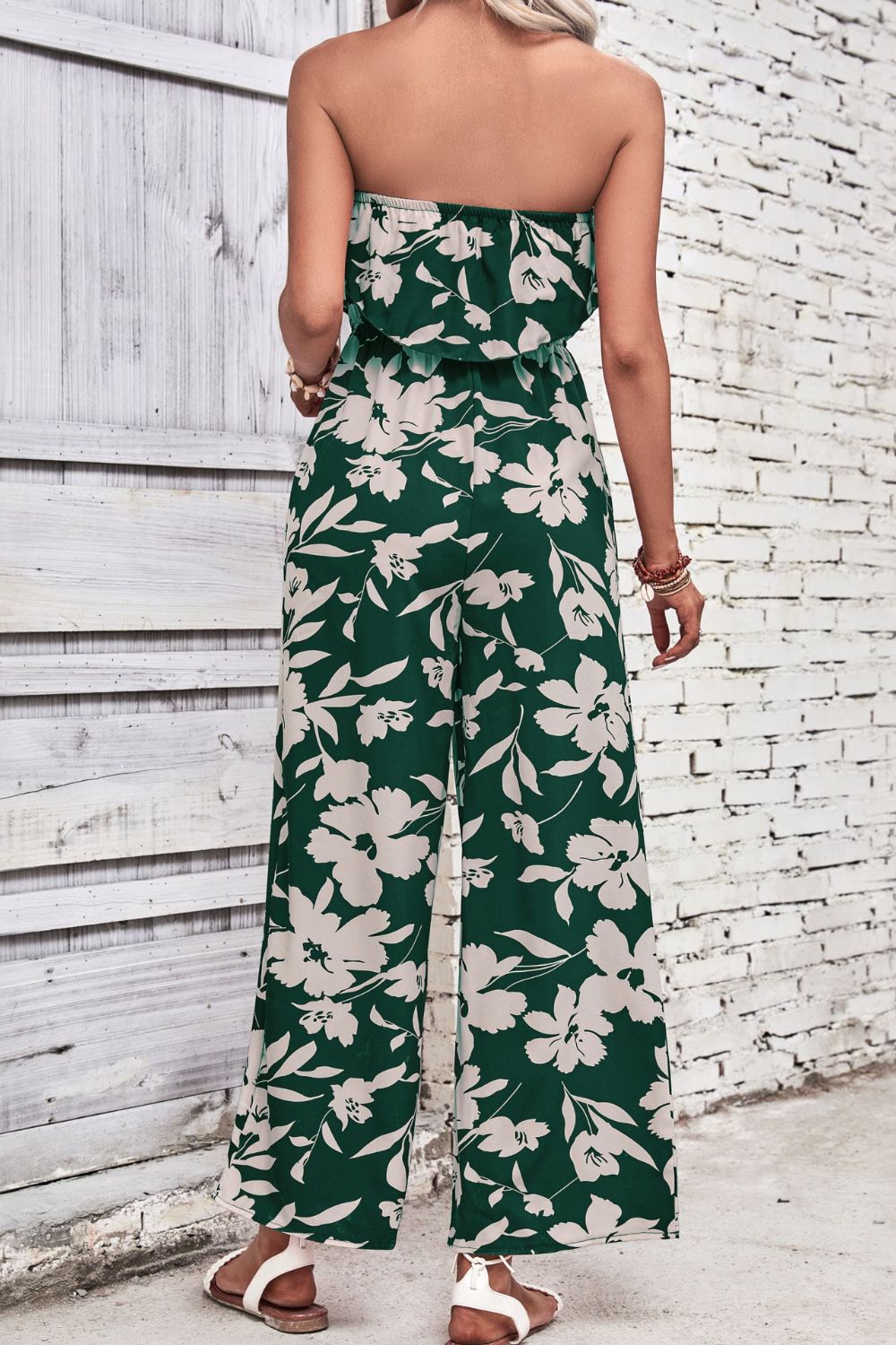 Dark green floral ruffle bandeau palazzo jumpsuit with wide legs.