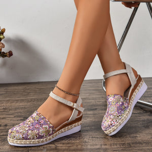 Floral espadrille wedge sandals with adjustable ankle strap in purple and ivory.
