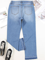 Whiskered wash cropped jeans in light blue denim with frayed hem detail.