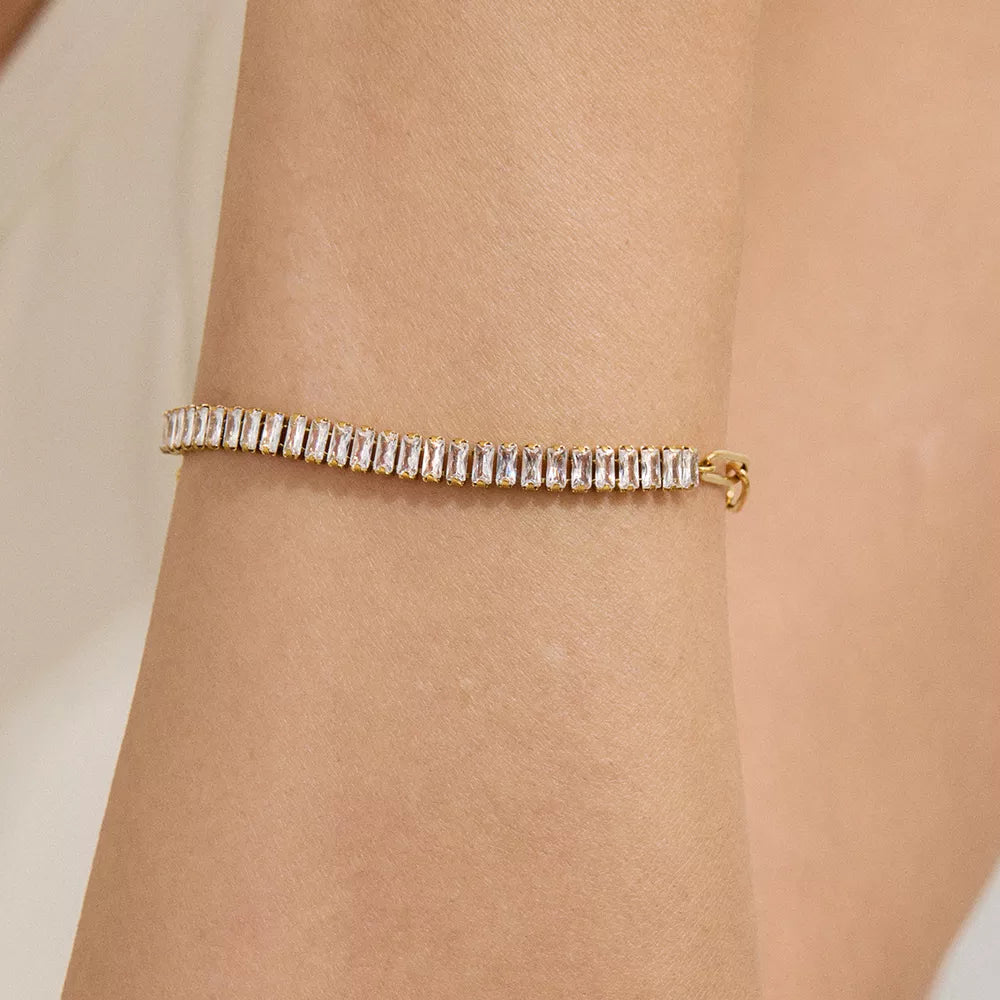 bracelet in gold featuring rhinestone embellishment and fitted fit