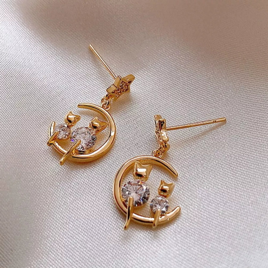 earrings in gold featuring dangle and dangle fit
