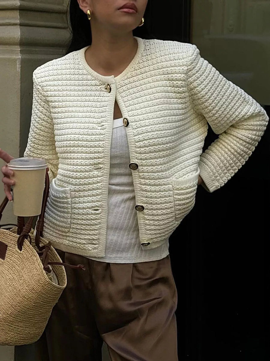 Textured button-down cardigan in cream with gold buttons and patch pockets.