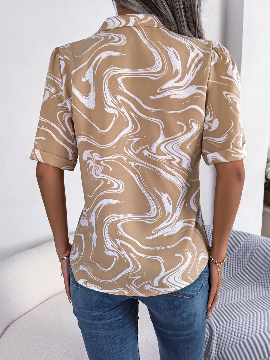 Khaki swirl print camp collar blouse with short sleeves and rolled cuffs.