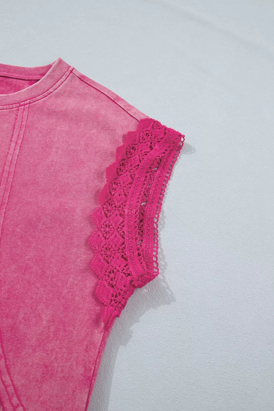Pink mineral wash t-shirt with cap sleeves and intricate lace trim detail.