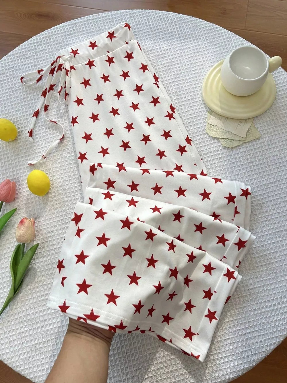 pants in White with star-print and drawstring waist