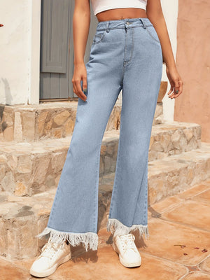 Light wash denim flare jeans with frayed hem detail