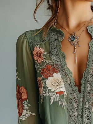 Green floral embroidered lace blouse with deep V-neck and bishop sleeves.