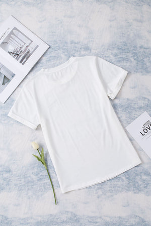 White graphic t-shirt with floral accents and short sleeves.