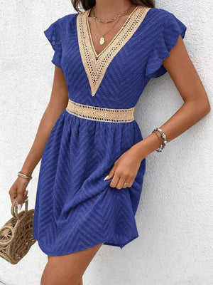 Royal blue chevron textured mini dress with V-neck and defined waist.