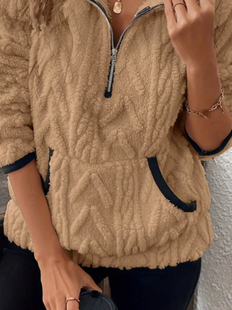 Khaki sherpa half zip sweatshirt with chevron texture, contrast trim pockets and cuffs.