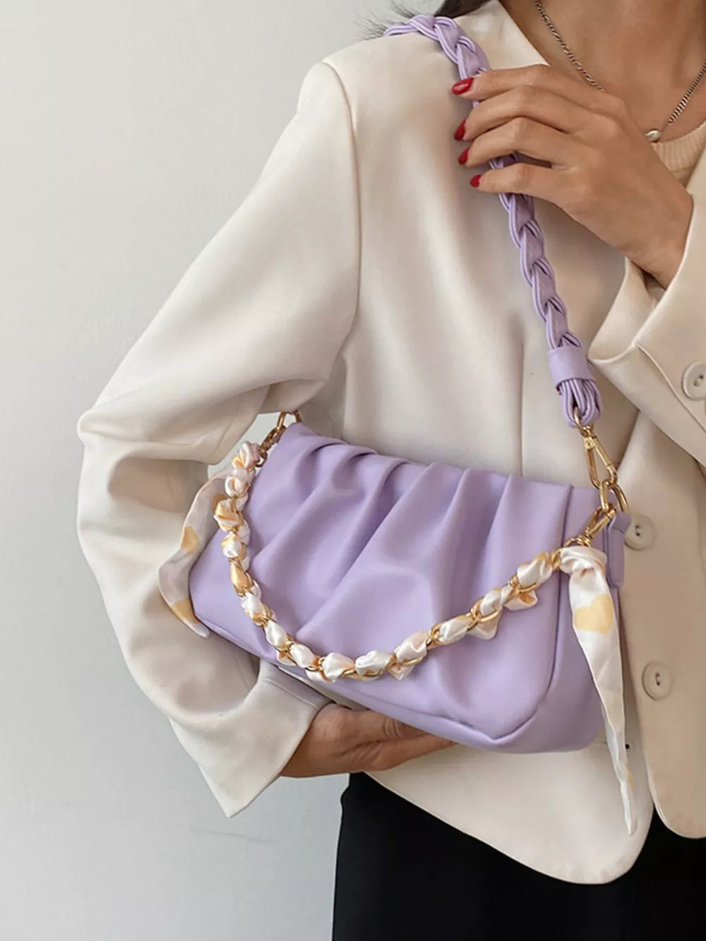 Purple ruched shoulder bag with braided strap and scarf detail