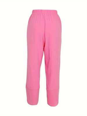 Relaxed fit wide-leg pants in bright powder pink with elastic waist and cuffed hems.