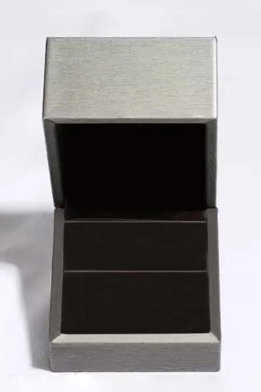 Silver moissanite ring box with open lid and dark interior.