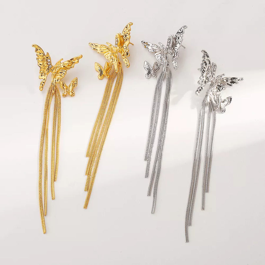 silver earrings featuring dangle and butterfly