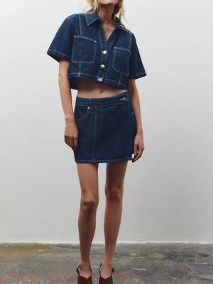 Dark blue cotton cropped button-up top and skort set with contrast stitching.
