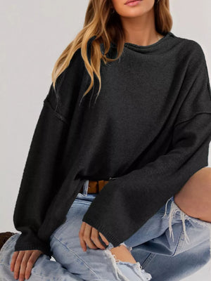 Black relaxed mock neck sweater with mock neck