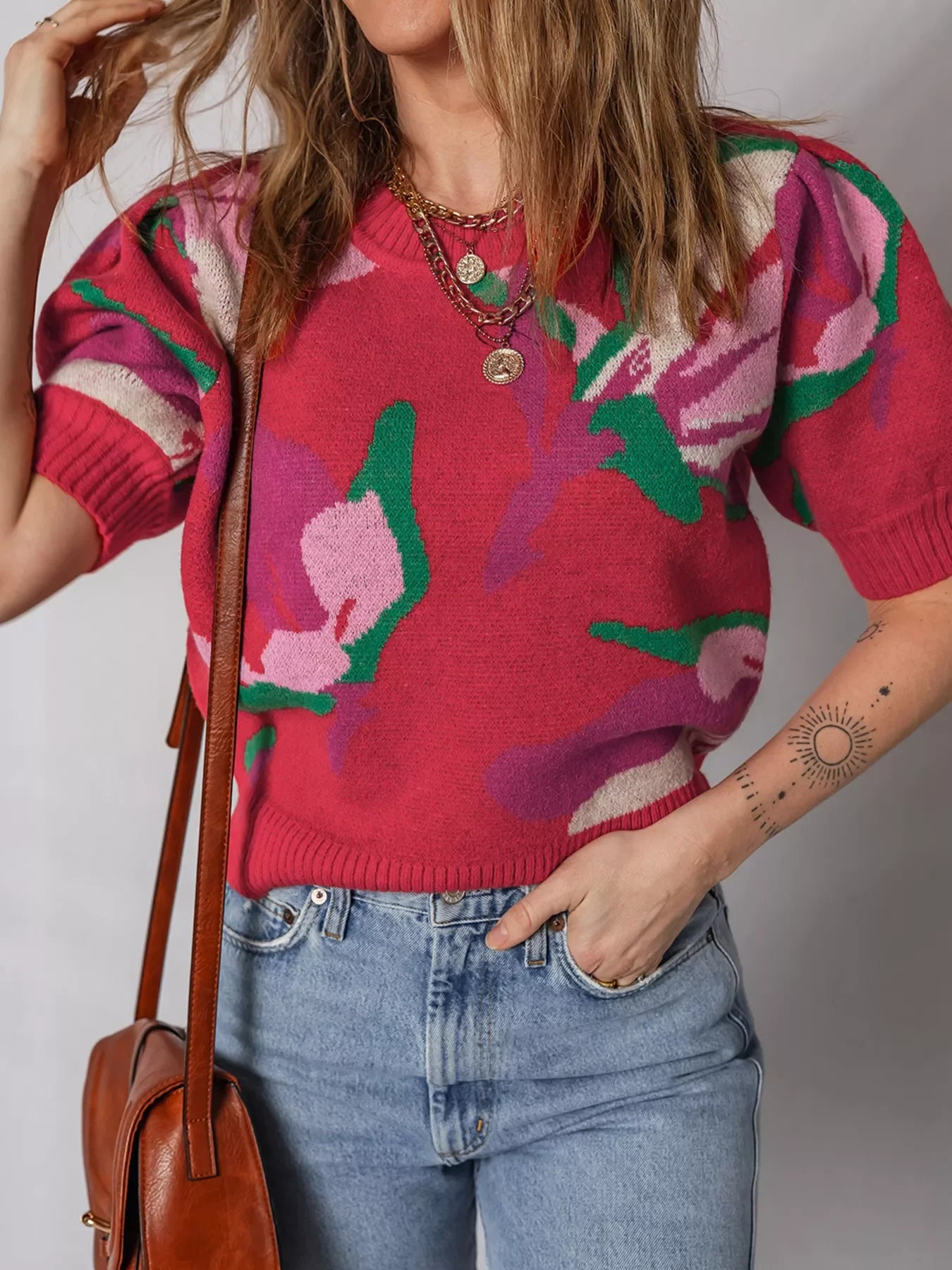 Women's scarlet abstract floral puff sleeve sweater with crew neck and short sleeves.