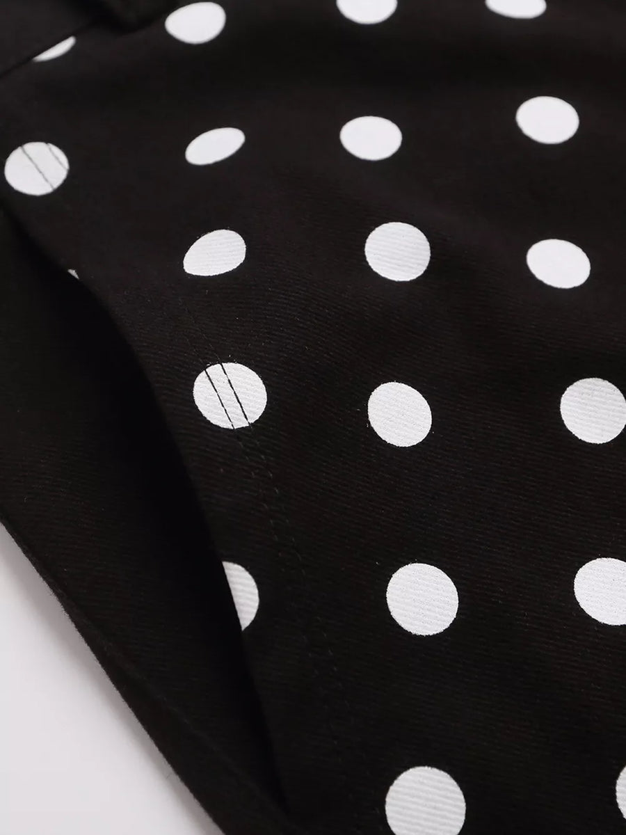 Black polka dot cargo shorts with a visible pocket detail.