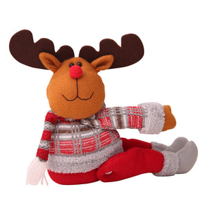 Reindeer curtain tieback with red and gray plaid sweater and red pants.