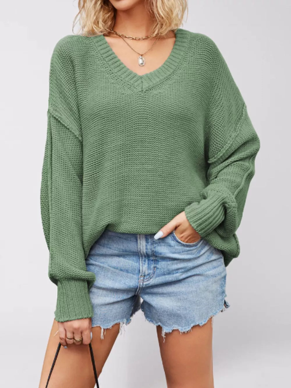 v-neck sweater in sage green featuring ribbed and loose fit