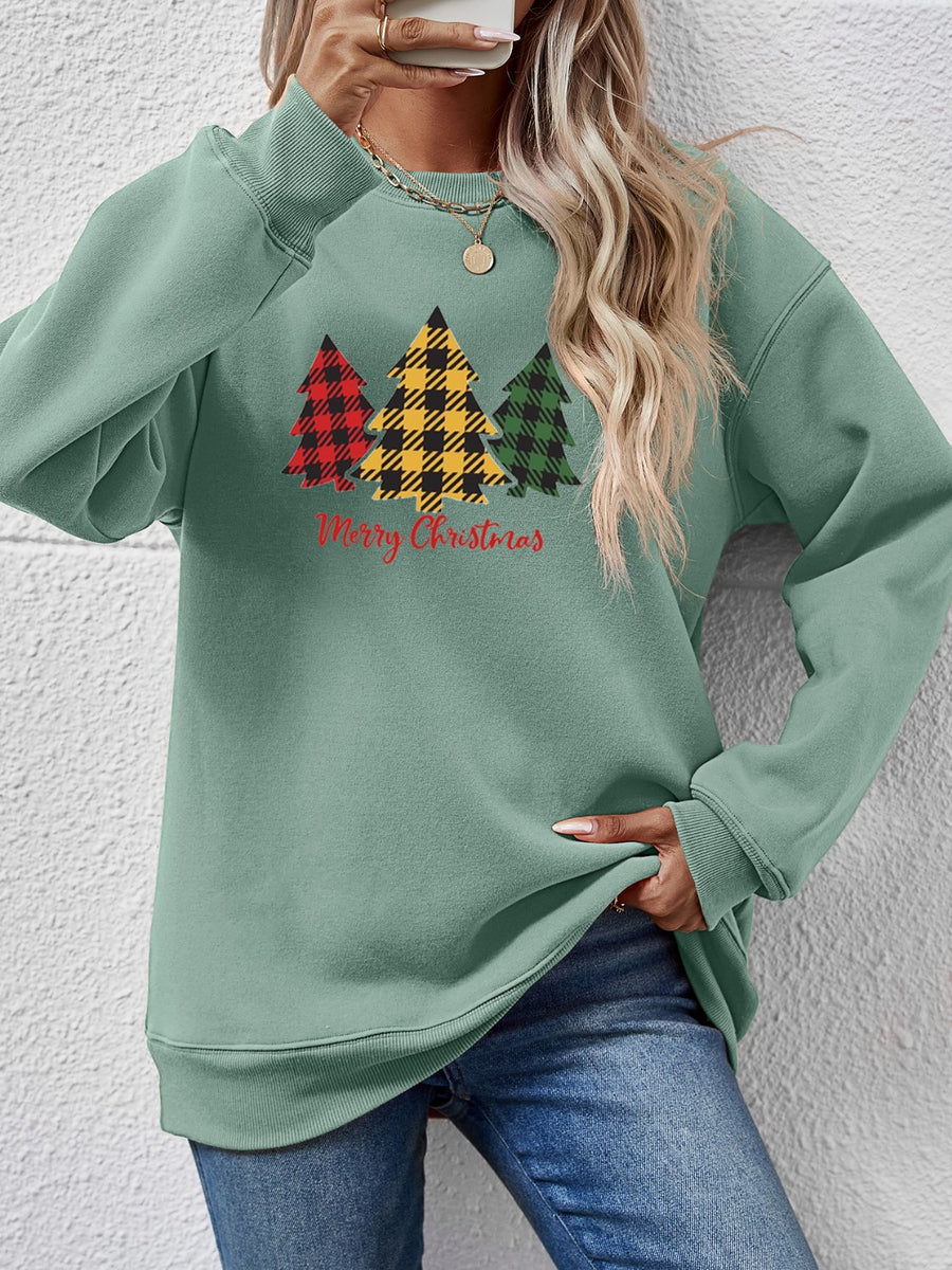 Sage green crewneck sweatshirt with plaid Christmas trees graphic and Merry Christmas text.
