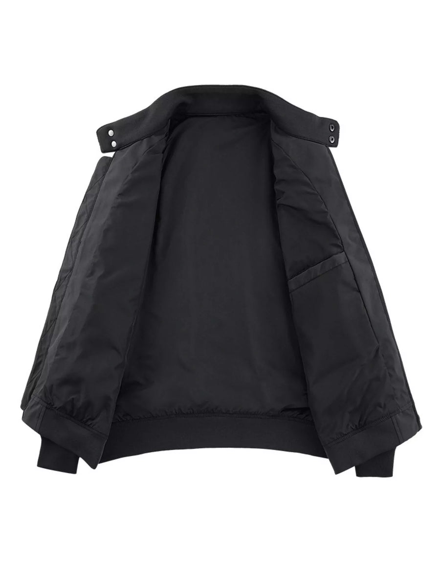 Plus-size black bomber jacket with zip front and snap collar details.