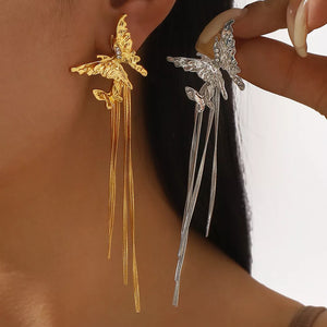 earrings in gold featuring dangle and dangle fit