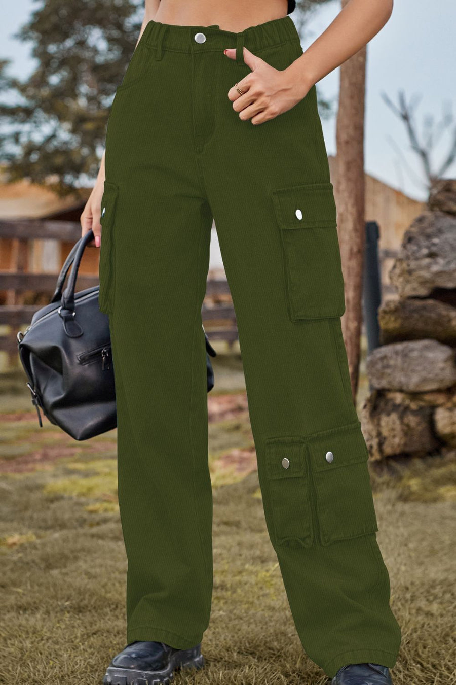 Army green denim cargo pants with relaxed wide leg and multiple utility pockets.