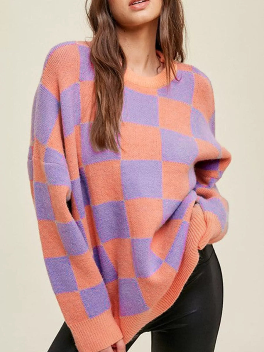 Chic checkerboard knit sweater in multicolor with crew neck and long sleeves.
