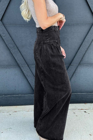 Black pleated front palazzo jeans with a high waist and wide leg.
