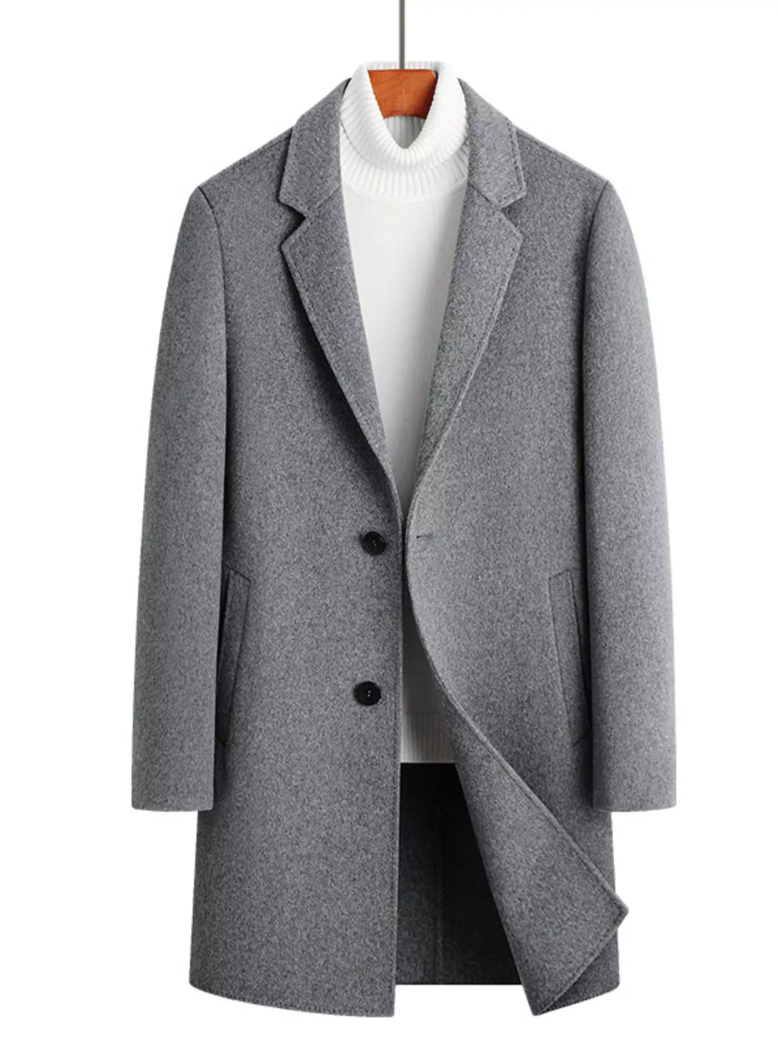 Men's gray wool blend overcoat with two buttons and notched lapels, styled over a white turtleneck.