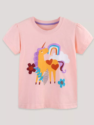 Children's blush pink cotton t-shirt with a colorful unicorn, rainbow, and floral graphic.