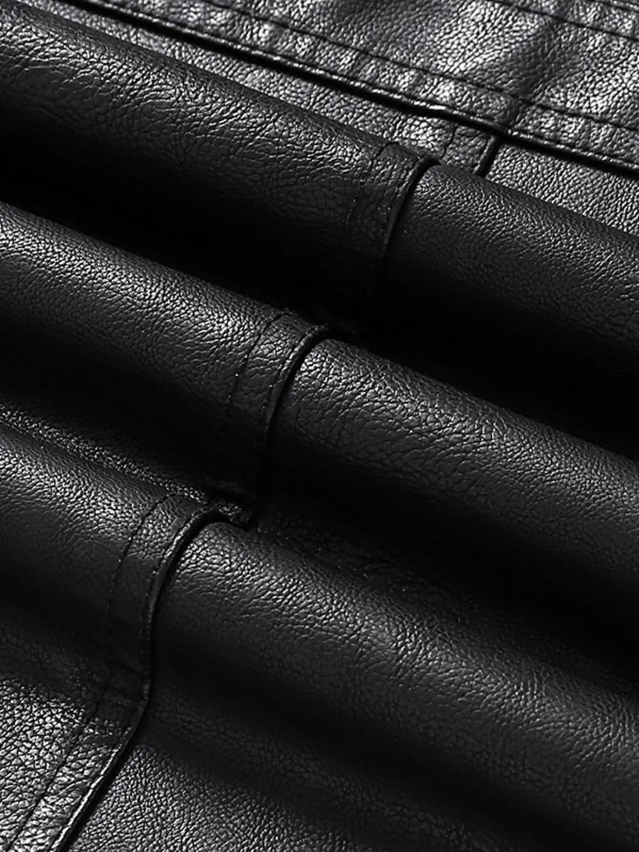 Black faux leather sport jacket detail with textured material and stitching.