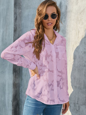 Pink sheer button-down blouse with floral embroidery and a collared neckline.