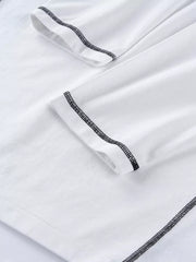 White t-shirt featuring contrast stitching and graphic