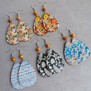Botanical drop earrings with wood bead in floral and geometric prints.