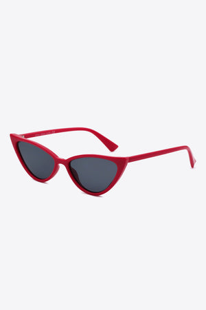 Crimson cat-eye sunglasses with dark lenses and bold frames.