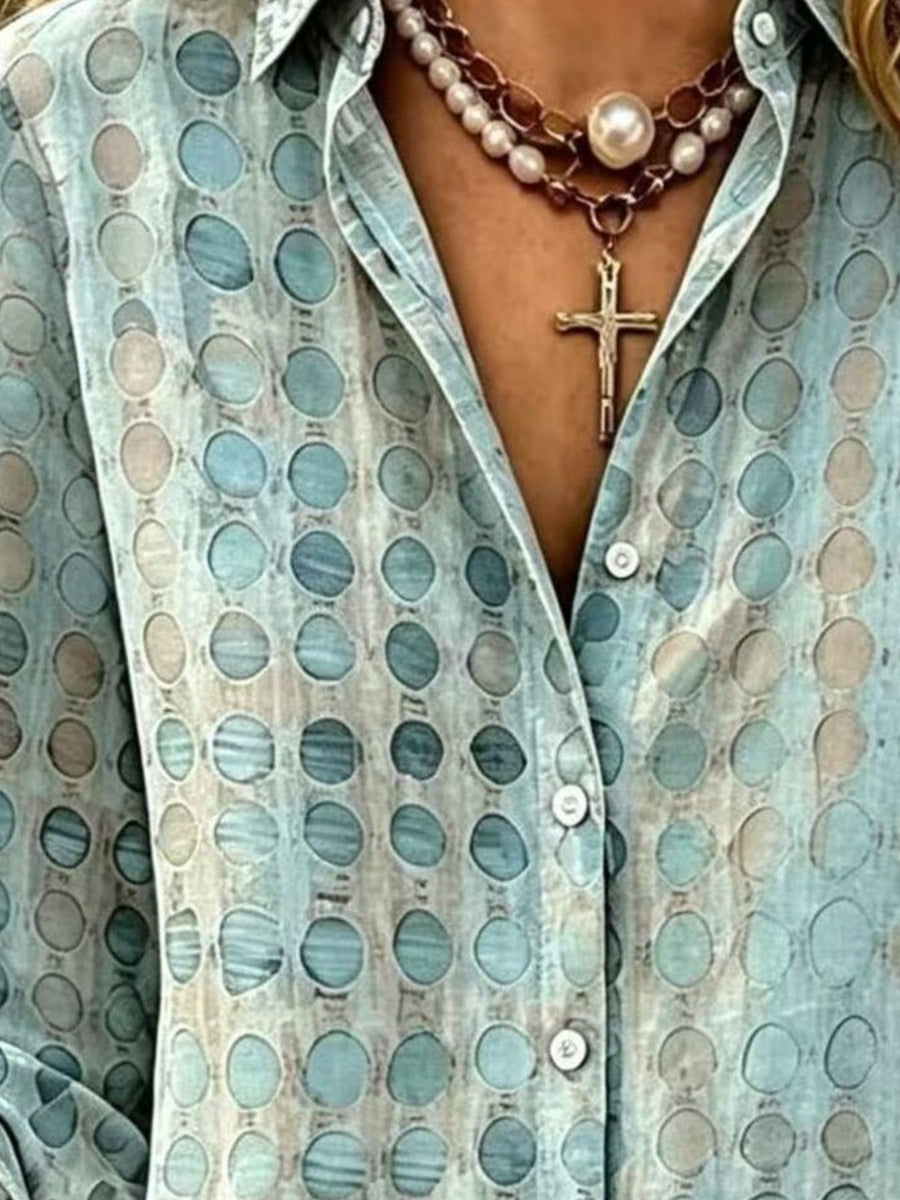 beige button-up shirt featuring buttoned and geometric