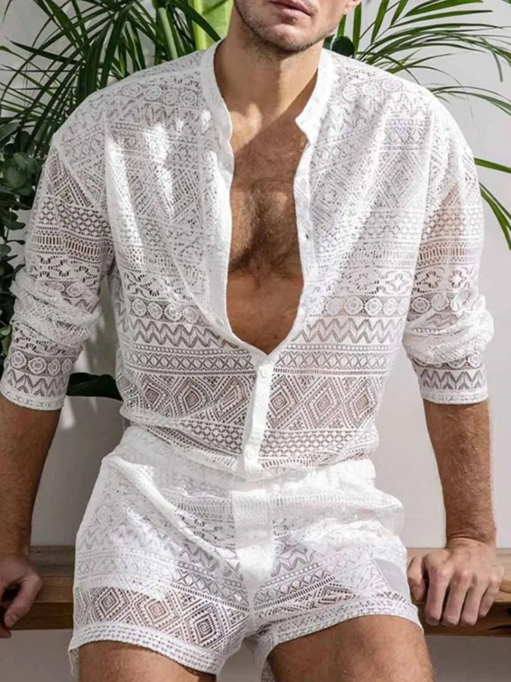 White open-weave crochet resort set with geometric patterns, button-up shirt and shorts.