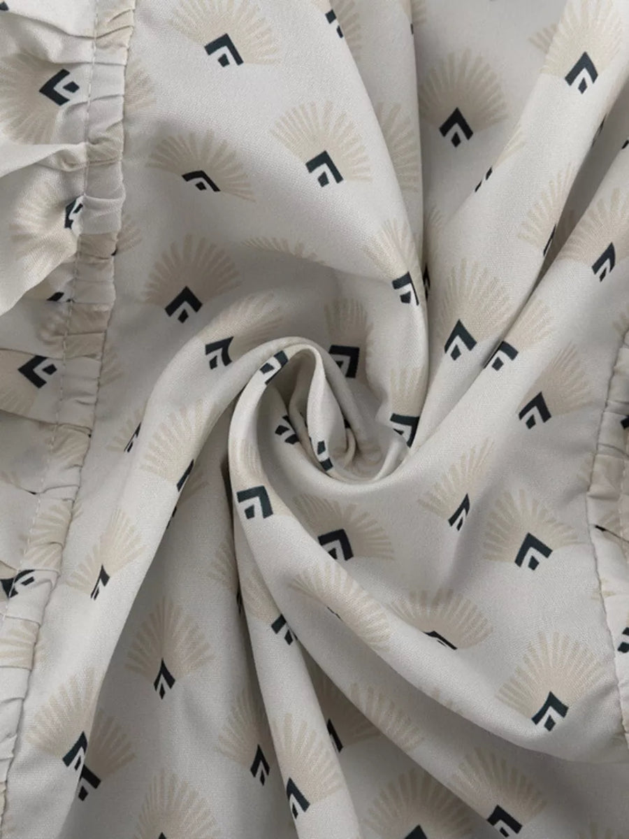 White fabric with fan and diamond pattern, ruffled trim