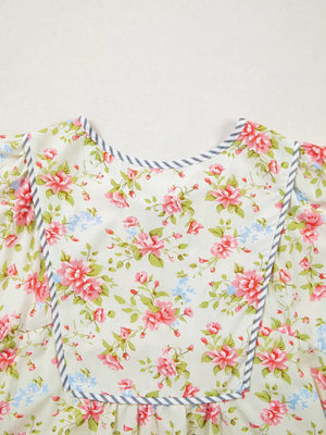 Cotton floral dress with puff sleeves and grey striped trim.