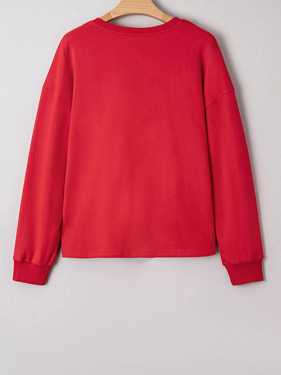 Red cotton crewneck sweatshirt with long sleeves and ribbed cuffs.