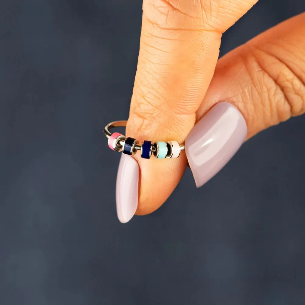 Chromatic Bead Sterling Ring with pink, navy, and aqua beads.