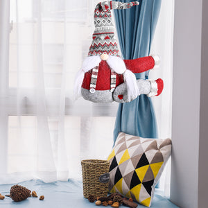 Christmas gnome with red and gray patterned hat and red coat.