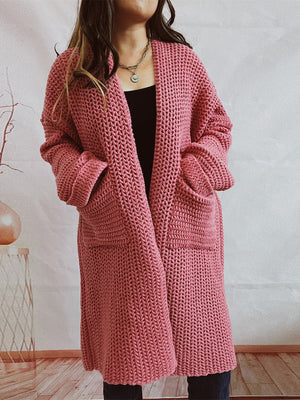 Chunky knit cocoon cardigan coat in dusty pink with oversized sleeves and pockets.