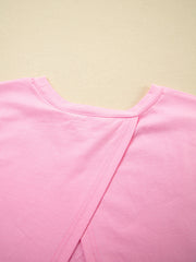 Pink cotton blend oversized tee with a crossover back detail.